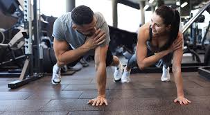 Toning Bingo Wings: Your Ultimate Guide to Sculpting Sleek Arms at the Gym 3 Fitness trainer demonstrating arm toning exercises Lewes