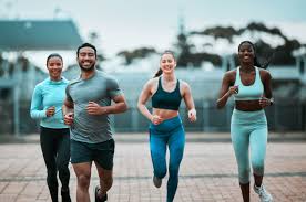 Sculpting Sleek Arms: The Essential Role of Cardio in Toning Without Bulking Up 3 image of people running to incorporate cardio Lewes exercise into their life to help tone arms and body.